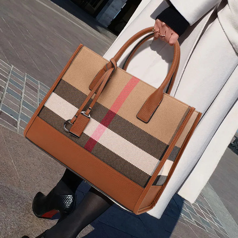 Luxury Canvas and Leather Tote Bag, Side View, Held by Fancy Female, Urban Background, Lifestyle Image